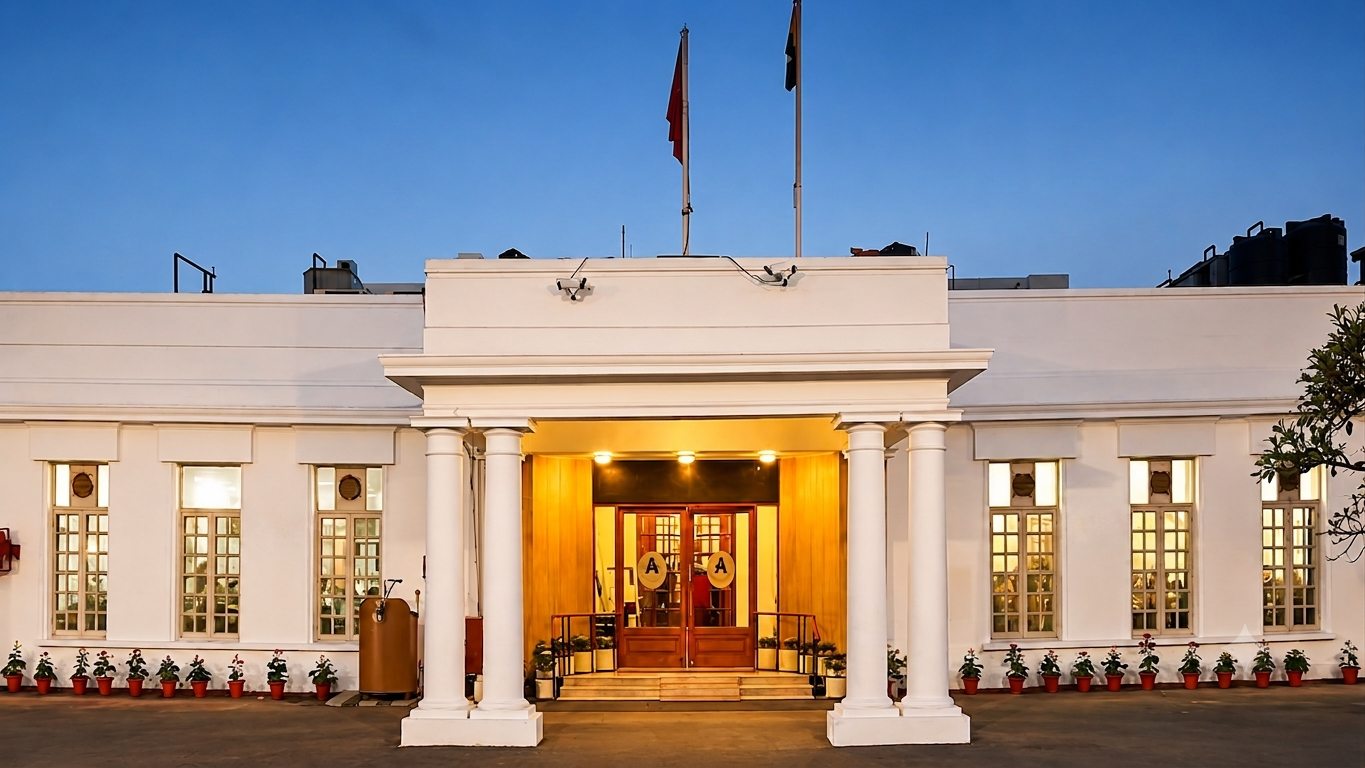 Heritage colonial-era clubhouse with colonnaded facade and sweeping lawns